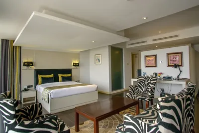 Cloud Hotel Master Suite with separate sitting area and Nairobi skyline views